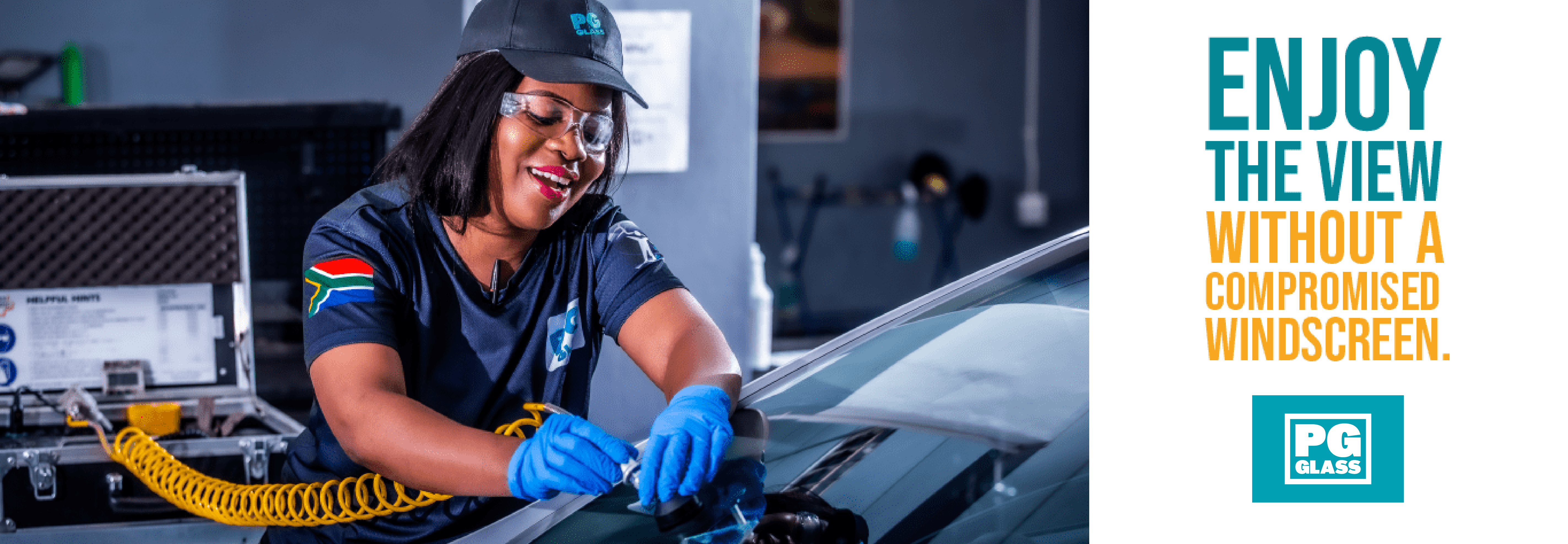 PG Glass banner: Smiling PG Glass technician working on a windscreen.
